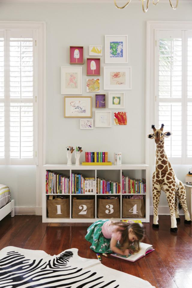 gallery wall over bookcase