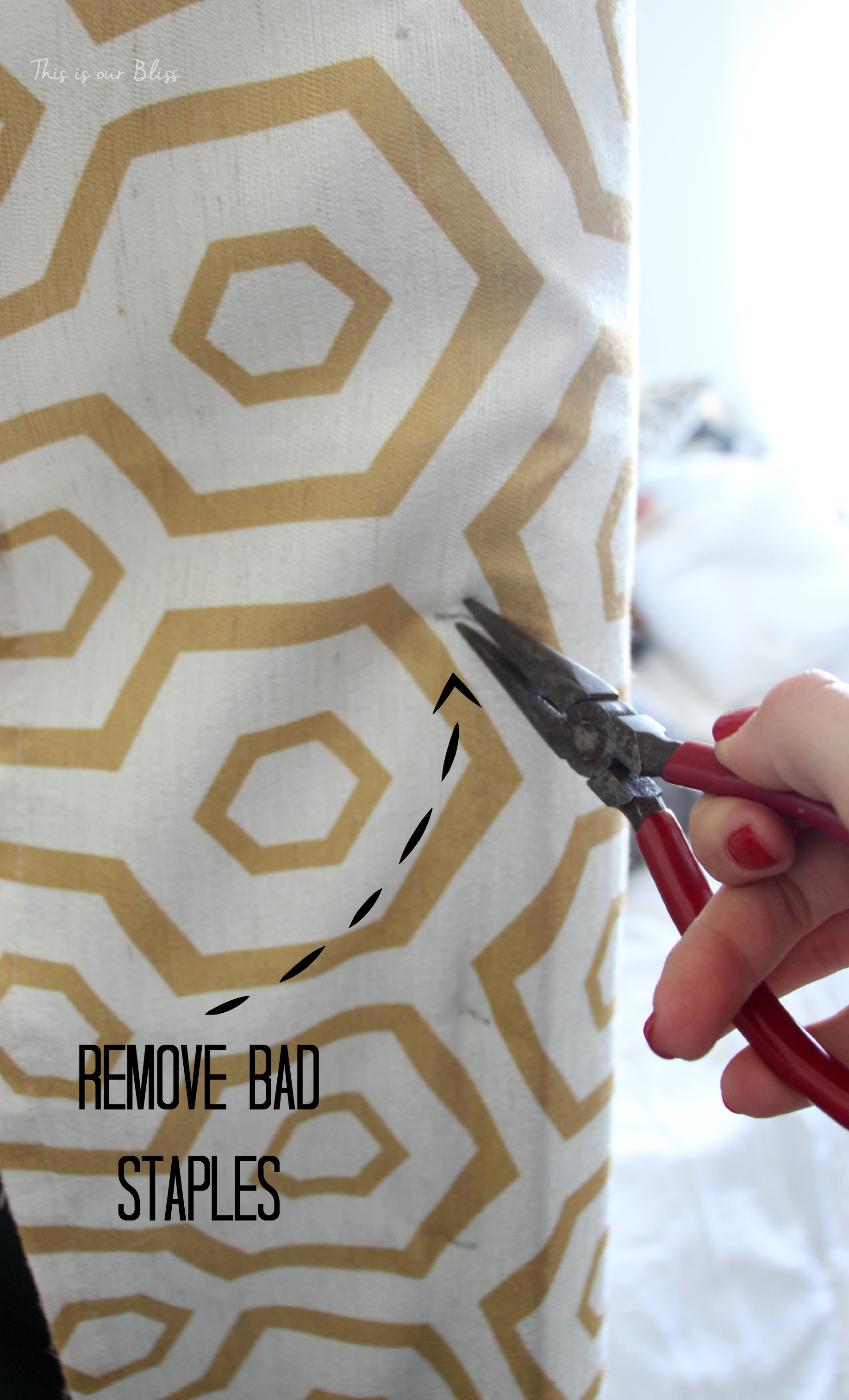 hwo to reupholster a headboard with a curtain panel - remove bad staples with needlenose pliers - this is our bliss